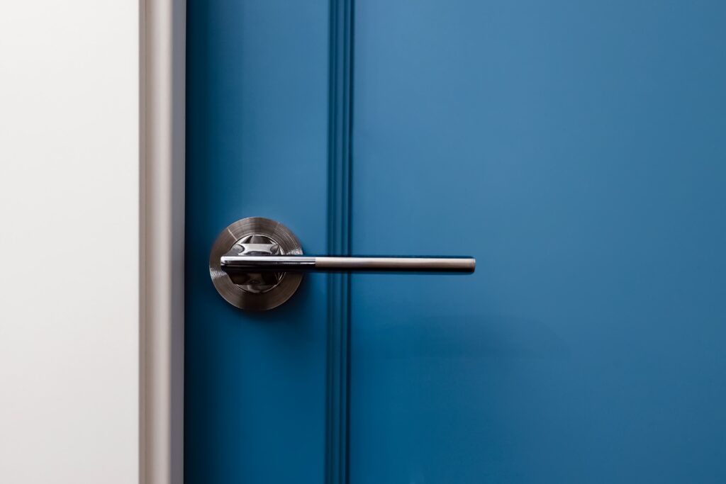 Blue door and grey flooring