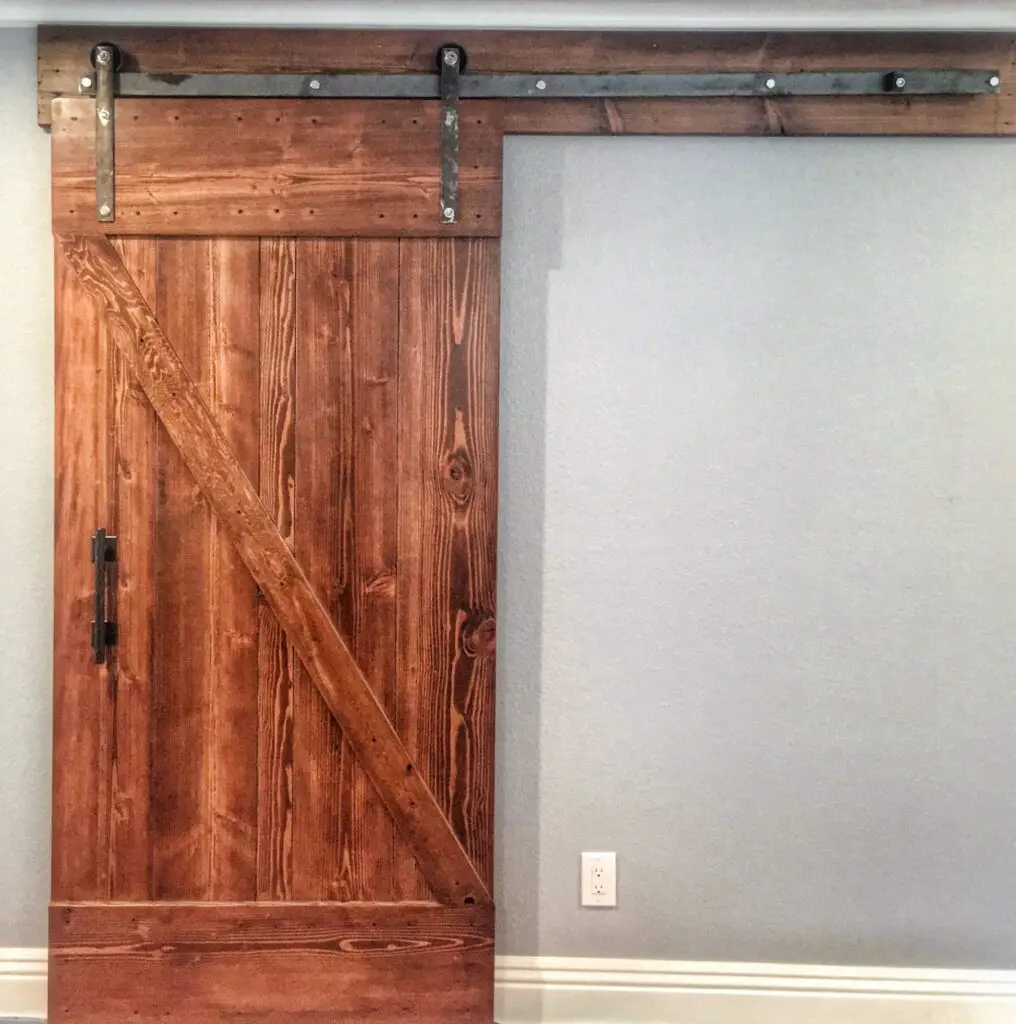 Wood barn door and grey flooring