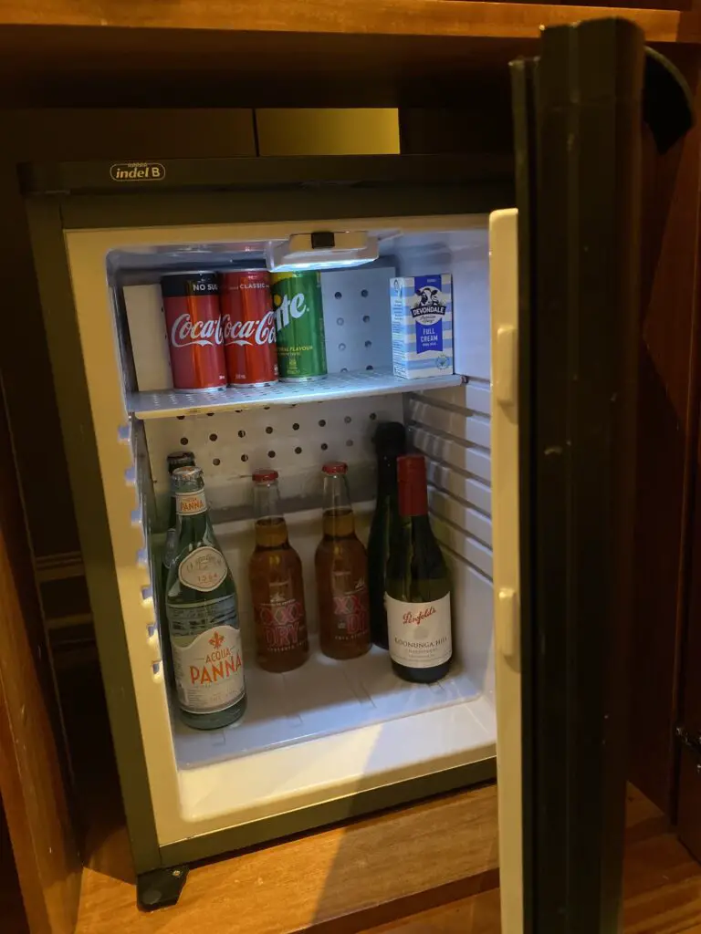 mini fridge opened with drinks inside