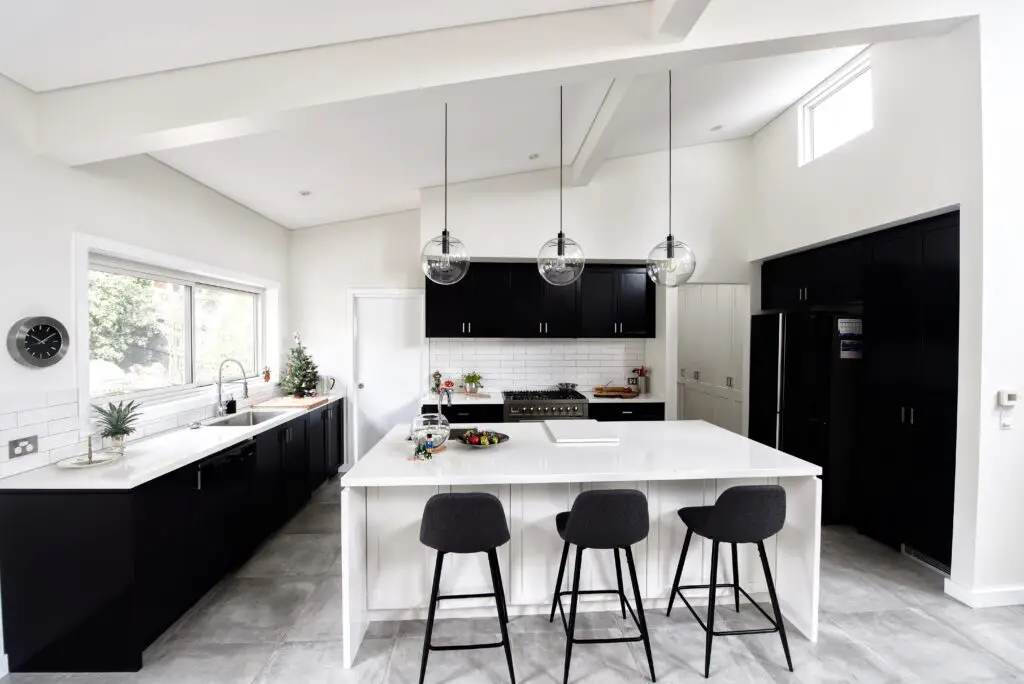 designer kitchen with black cabinets - where should the kitchen be in the house?